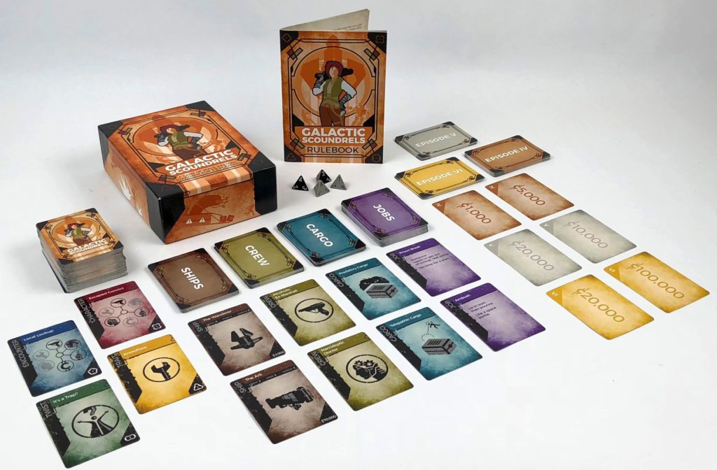 Image of Galactic Scoundrels game showing all the cards, box, rulebook, and dice